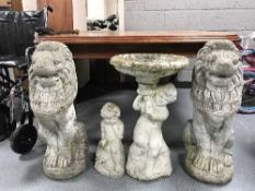 A pair of stone garden lions,