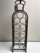 A metal eleven bottle wine rack