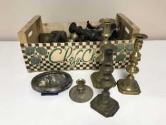 A box of brass candlesticks,