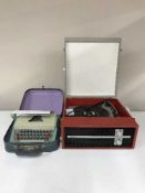 A mid 20th century table top Fidelity record player and a cased typewriter