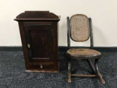 A child's Bentwood rocking chair and a wall cabinet