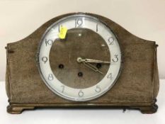 A walnut cased mantel clock