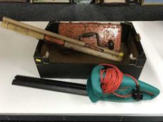 A hedge trimmer, welding rods,