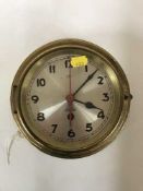 A circular brass ship's wall clock by Viking