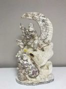 A large carved oriental figure - fisherman on waves