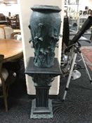 A turquoise jardiniere on stand