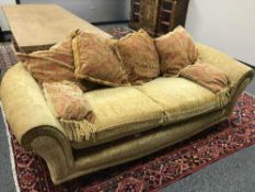 A contemporary two seater settee with scatter cushions