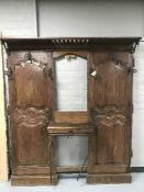 An antique oak panelled hall stand