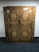 A Chapmans Siesta burr walnut double door wardrobe