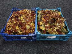 Two crates containing a large quantity of imitation amber bracelets and bead necklaces (Q)
