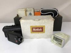 A box of Agfa camera, Kodak cine camera, photographic lamp,