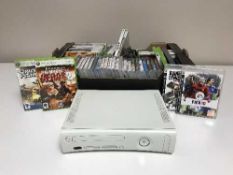 A box of Xbox console, games,