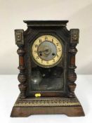 A late 19th century American pine cased mantle clock