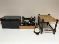 An electric Singer sewing machine, deed box,