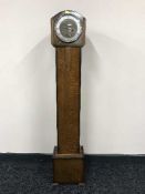 An oak Granddaughter clock