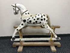 A late Victorian hand painting rocking horse on pine stand