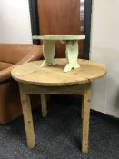 A rustic pine table and a small painted stool