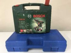A cased Bosch 18 volt drill and a cased laser level kit