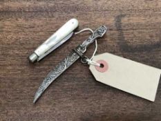 A Russian silver filigree miniature dagger in sheath,