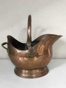 An antique copper coal bucket
