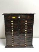 An antique mahogany multi drawer miniature collector's chest