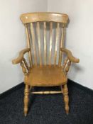 A pine kitchen armchair