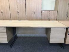 A single pedestal desk with swivel armchair