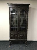 A carved oak leaded bureau bookcase