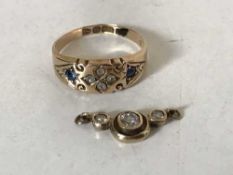 An 15ct gold sapphire and diamond ring and part diamond pendant