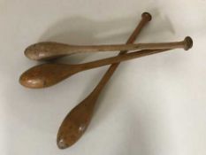 Three vintage wooden juggling batons