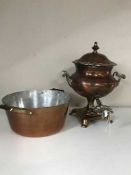 An antique copper samovar and a jam pan