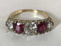 A fine 18ct gold ruby and diamond ring, the central stone approximately 1.1ct.