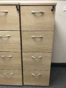 Four drawer wood effect filing cabinet with key