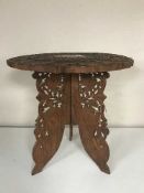 A heavily carved and inlaid Moorish table