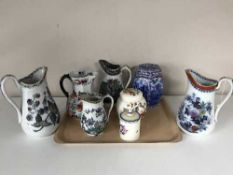 A tray of Masons Ironstone jug, three graduated late Victorian jugs, Ringtons caddy,