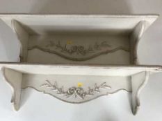A pair of pine painted wall shelves