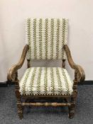 A carved oak continental armchair