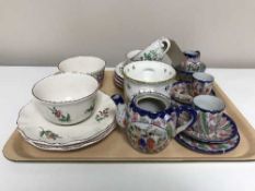 A tray of French Luneville cups and saucers, oriental china tea for two,