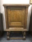 An oak single door cupboard