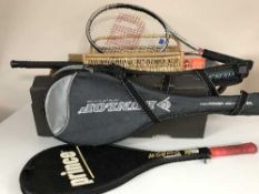 A box of tennis racket, parasols, wicker basket,