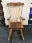 A teak rocking chair