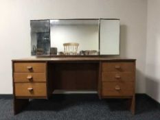 A mid 20th century teak dressing table and mirror
