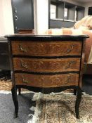 A continental inlaid walnut three drawer chest