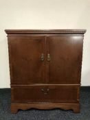 A yew wood TV cabinet