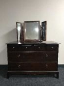 A Stag Minstrel six drawer chest with triple mirror