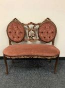 An antique style two seater settee