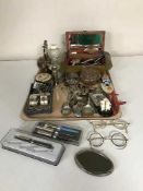 A tray of plated cutlery, napkin rings, jewellery box, costume jewellery, pens,