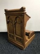 A carved oak church kneeler