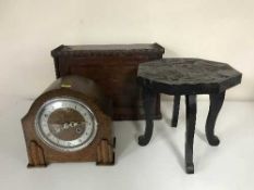An antique ebonised footstool,