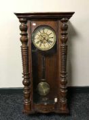 An Edwardian mahogany wall clock